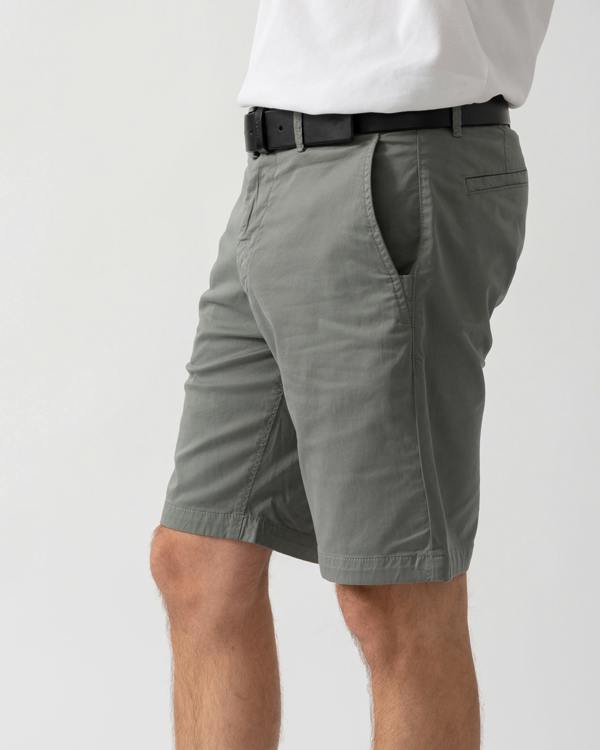 detail shot of a model wearing a pair of BOSS Orange Mens Slim Fit Chino Shorts in Stretch Cotton Twill in Open Grey 076