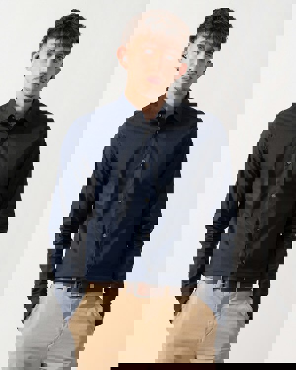 Model wearing a Ted Baker Baxters Mens Long Sleeve Slim Stretch Shirt in Navy