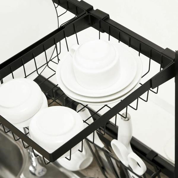 Close-up of black top wire shelf holding stacked white plates and bowls over sink