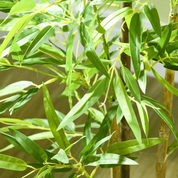Close-up of artificial green bamboo leaves and stems on an artificial plant