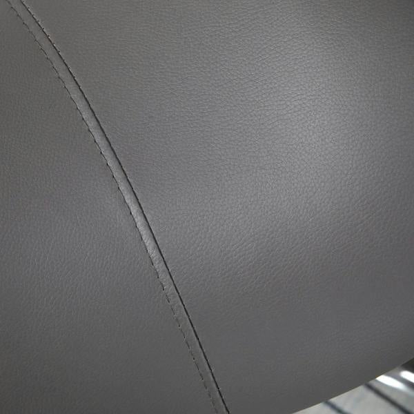 Close-up of grey faux-leather saddle seat with visible stitched seam