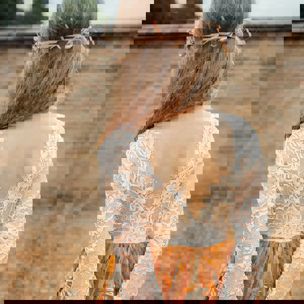 young girl wearing embroidered dress