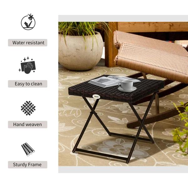 Brown folding rattan coffee table with woven tabletop and sturdy X-frame legs
