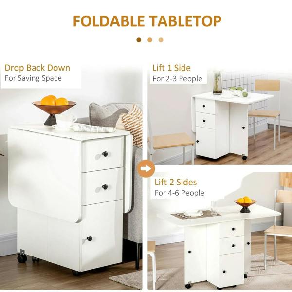 White drop-leaf dining table with foldable tabletop and drawer cabinet on wheels.