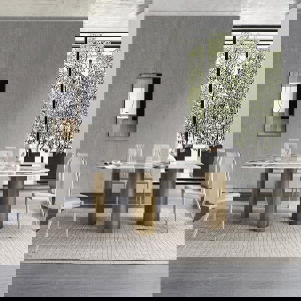 Detail view of Mira Dining Table, Gold Base with table decorations for dining table