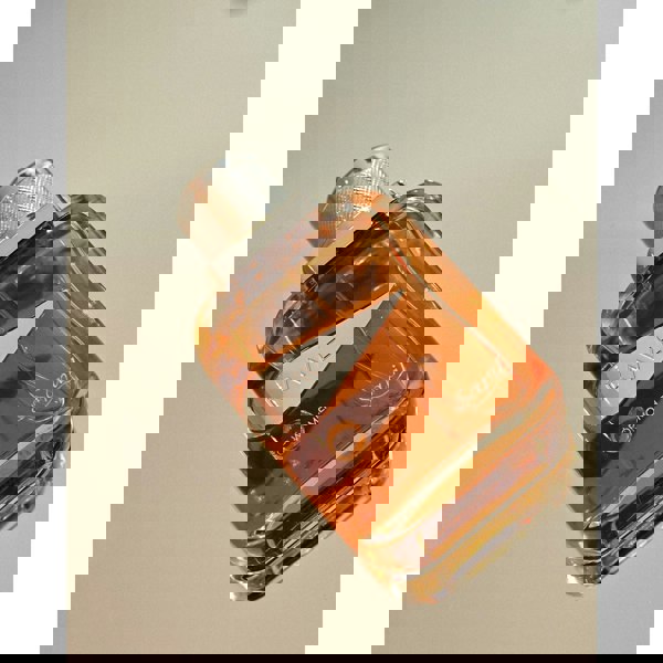 Rave Women Eau de Parfum bottle on neutral background