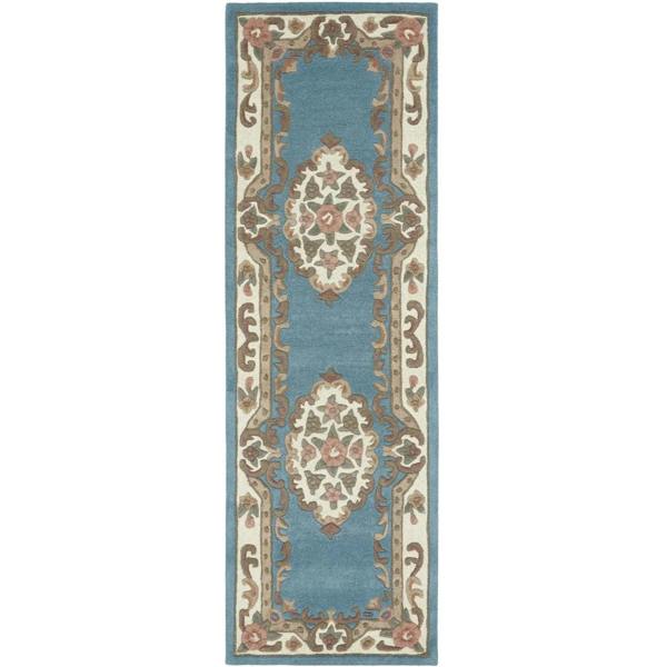 Decorative rug with intricate patterns on a white background