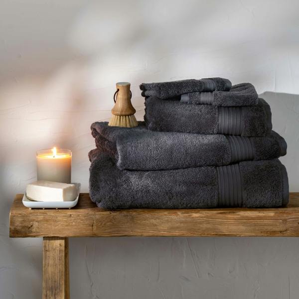 Smoke Egyptian Cotton Bath Towels styled in a bedroom | Soak and Sleep