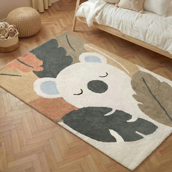 Children's rug with a bear design on a wooden floor