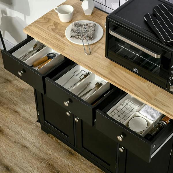 Black sideboard with open drawers and cabinet storage under a light wood top