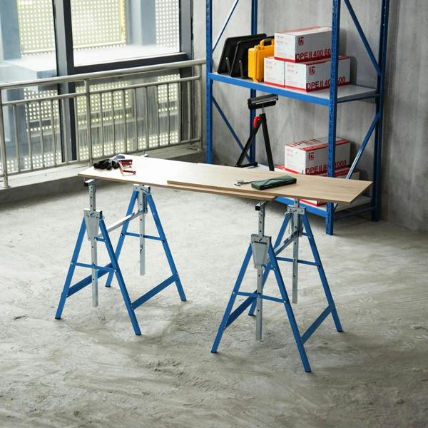 Blue folding steel sawhorse set with adjustable A-frame legs supporting workshop planks