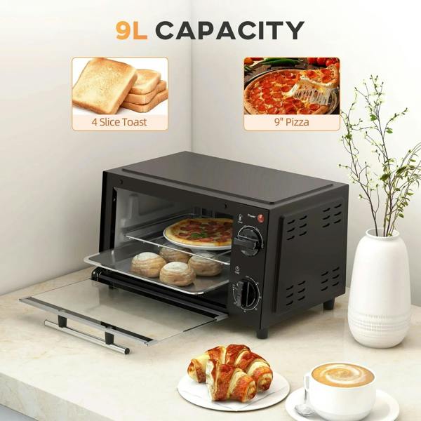 Black mini oven with glass door open, wire rack inside and baking tray pulled out.