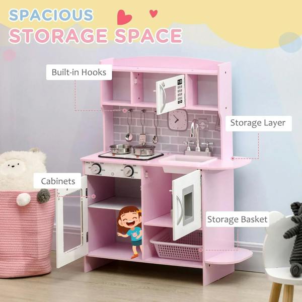 Pink kids kitchen playset with hanging hooks, storage basket, and cabinet under the sink