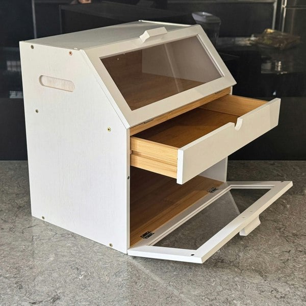 Wooden storage unit with a transparent top and open drawer on a gray surface.