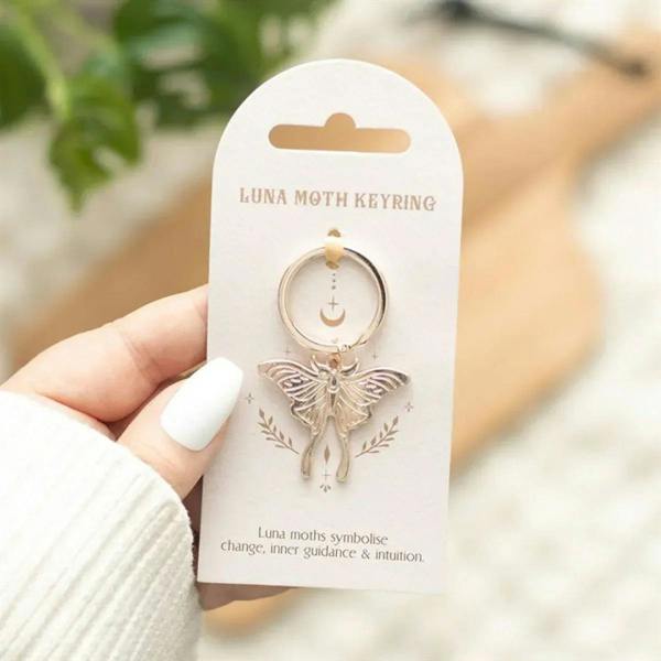 Luna moth keyring with round metal ring and silver moth charm, gold accent on top