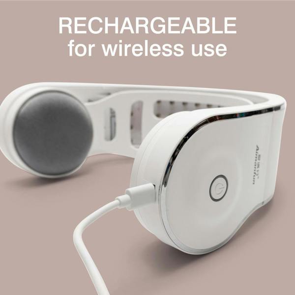 White Rio HairGrow Laser Head Band being charged with a USB cable on a light pink background. Text above reads: "RECHARGEABLE for wireless use—perfect to pair with your red light therapy or hair regrowth routine.