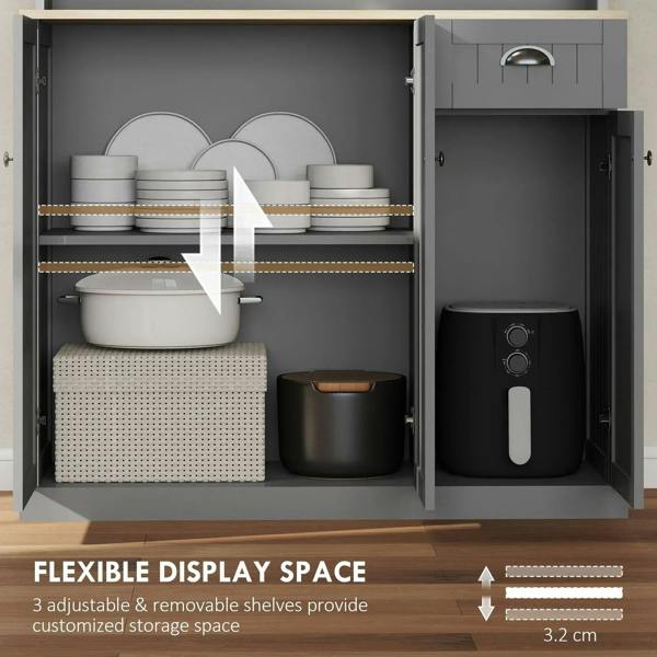 Grey cabinet with open doors showing stacked plates, pot, and air fryer compartment