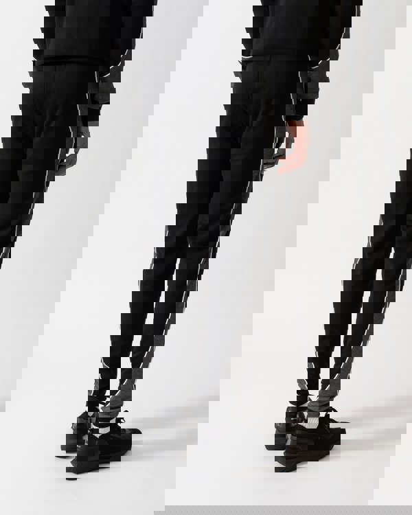 back shot of a Model wearing a BOSS Orange Mens Loungewear Tracksuit Pants in Black