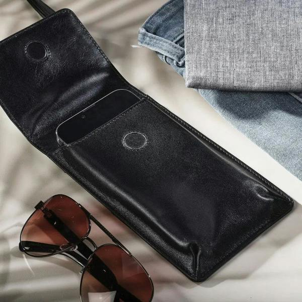 Wholesale black leather mobile phone bag designed for everyday use, travel and shopping.