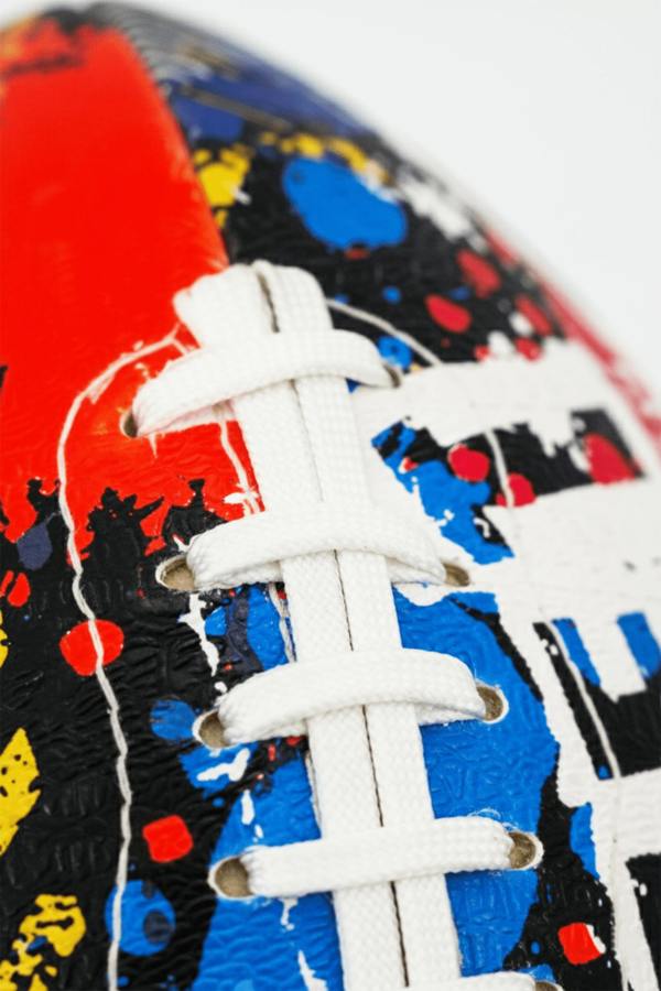 Macro close-up of white laces on graffiti-print Optimum Street football - Optimum