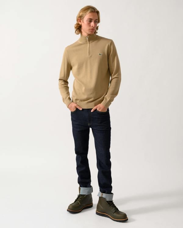 full length of a model wearing a Lacoste Half Zip Logo Mens Sweatshirt in Cookie SIX