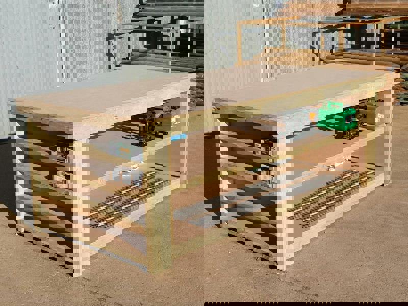 Wooden MDF top workbench with extra shelving and double shelf configuration, featuring a solid timber frame and smooth MDF work surface designed for practical workshop use