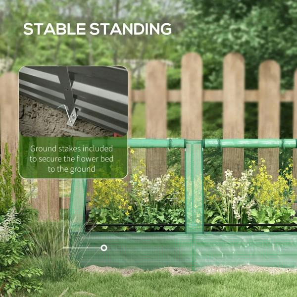 Green raised planter bed with greenhouse cover and included ground stakes for stability