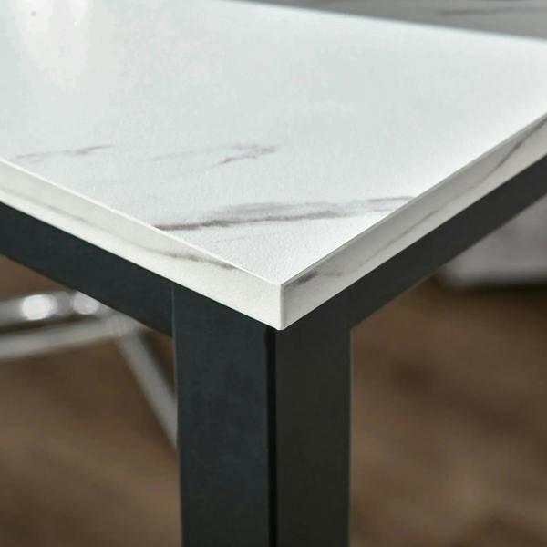 Close-up of white marble-effect top corner on black rectangular bar table frame