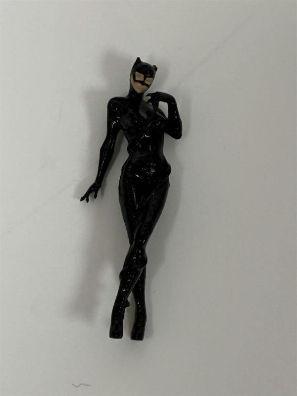 a black catwoman doll