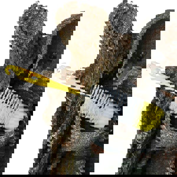 Rustic brook electric water feature with a textured tree bark design, featuring a yellow cleaning brush for maintenance