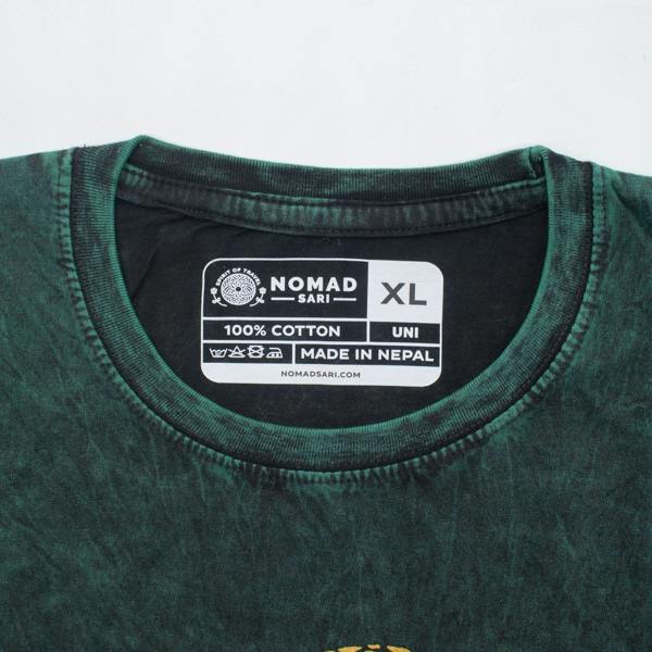 Green cotton t-shirt neckline tag showing XL size on dark green shirt