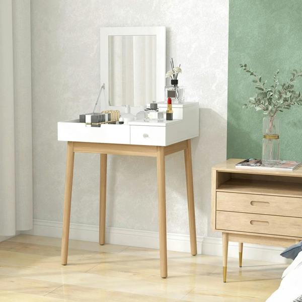 White vanity table with flip-up mirror and drawers, light pine legs in a bedroom setting