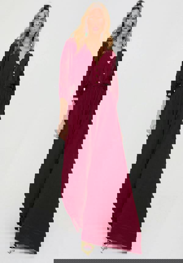 Woman wearing a burgundy dress on a white background