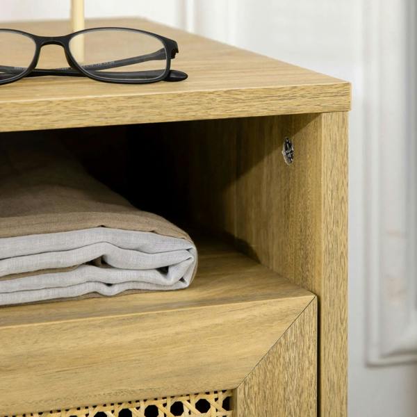 Corner view of natural wood bedside table with open shelf and rattan cabinet door