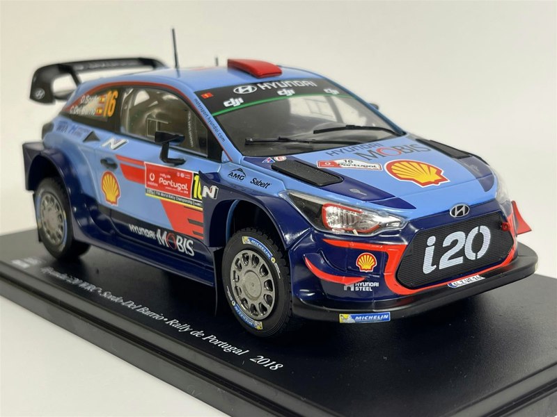 a blue race car with red and blue stripes