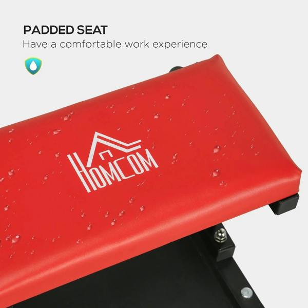 Red padded seat on rolling stool with thick vinyl surface and black base supports