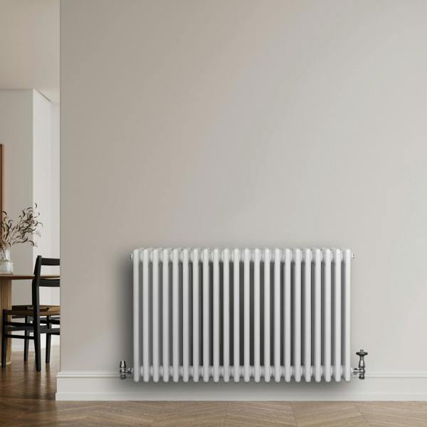 Traditional white 4 column radiator, 600 x 1010mm, featuring a sleek design with smooth, glossy finish, mounted on a light wall