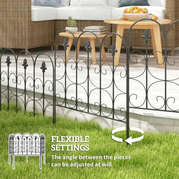 Black metal fence panels with spear finials and curled scroll loops in a yard setting