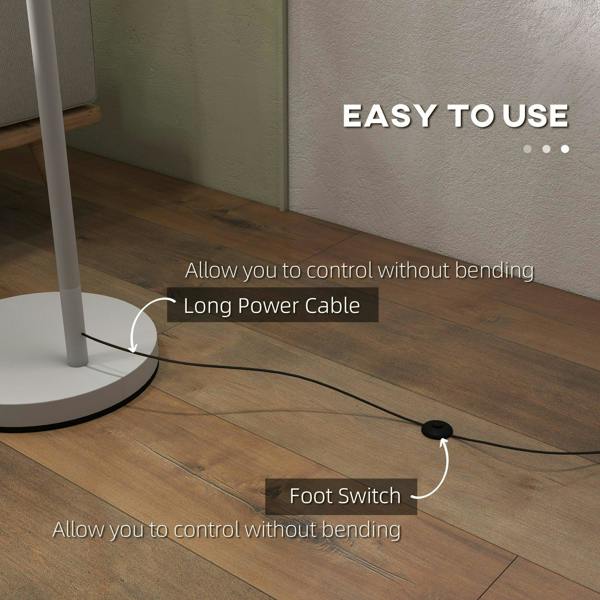Grey floor lamp with long power cord and foot switch at round base