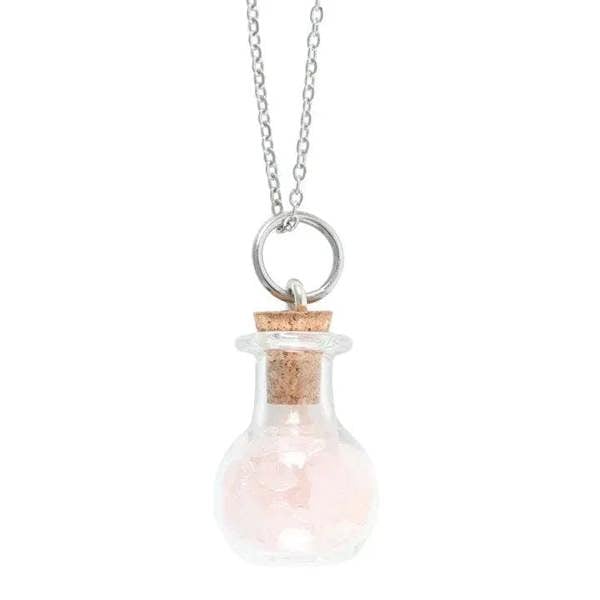 Small glass potion bottle pendant with pink stone chips and silver loop on chain