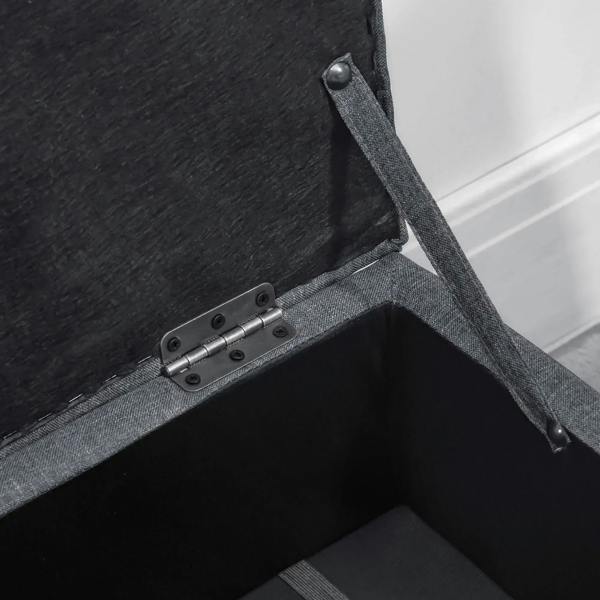 Dark grey storage ottoman lid hinge and interior compartment latch detail