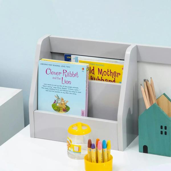 Grey kids desk with book storage shelf and colorful pencil cup