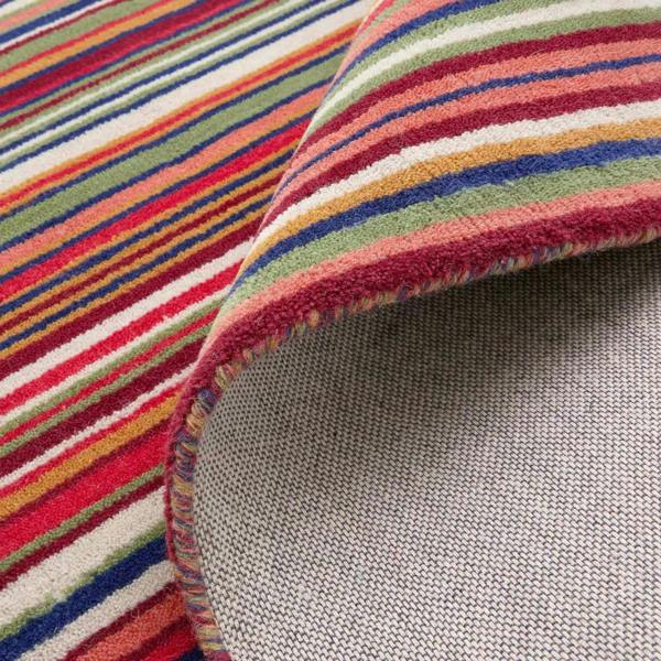 Close-up of a multicolored striped fabric with a textured gray border.