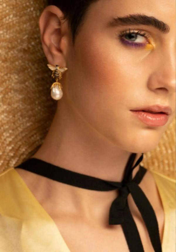 The earring worn by a model.
