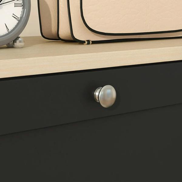 Black shoe cabinet drawer front with round brushed metal pull knob