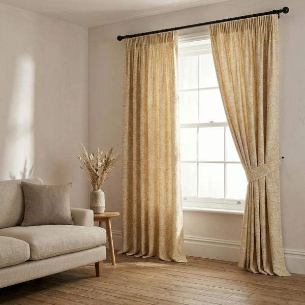 Lille made-to-measure curtains in Saffron, styled in a living room