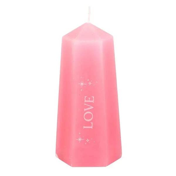 Pink faceted pillar candle with 'LOVE' and star sparkle pattern