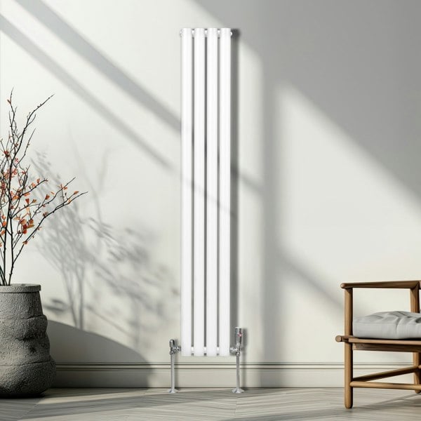 Chrome thermostatic radiator valves with sleek design, polished finish, and modern aesthetic, complementing a tall white radiator in a stylish interior