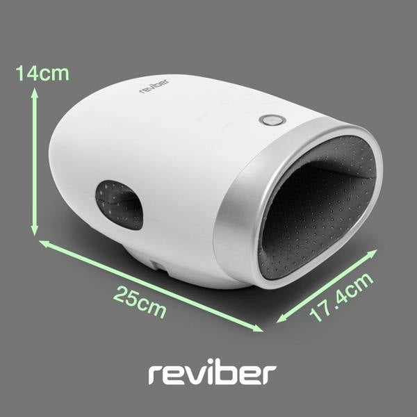 The Reviber Hand Spa Massager with Heat & Finger Stretch, shown in white and gray with a black interior, is displayed on a gray background. Green arrows highlight its dimensions: 25cm long, 17.4cm wide, and 14cm high. Developed by Reviber and inspired by deep tissue massage gun technology, this device provides targeted relief for your hands. The word "reviber" is visible below the product.