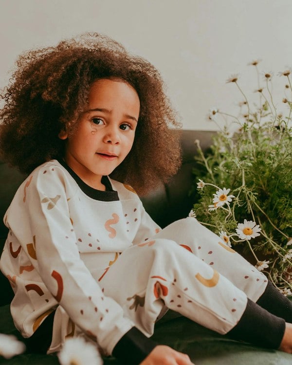 Girl wearing gender-neutral organic cotton kids joggers